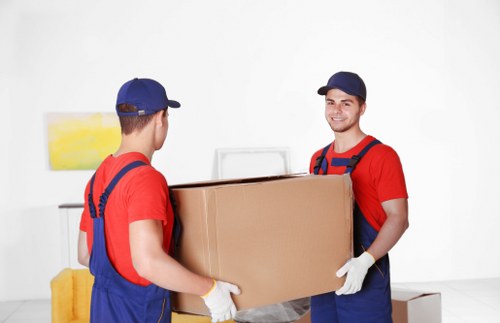 Professional office removals team handling desks and furniture for a Dagenham workplace relocation