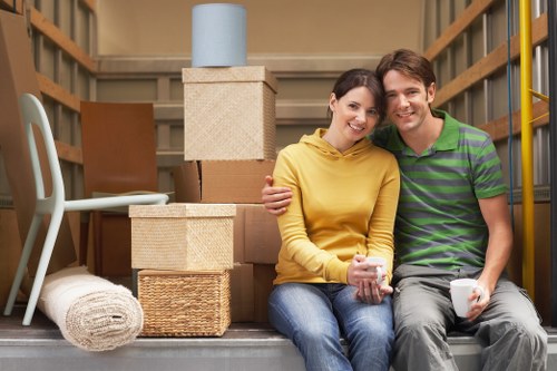 Loading household items into a van for a Dagenham move